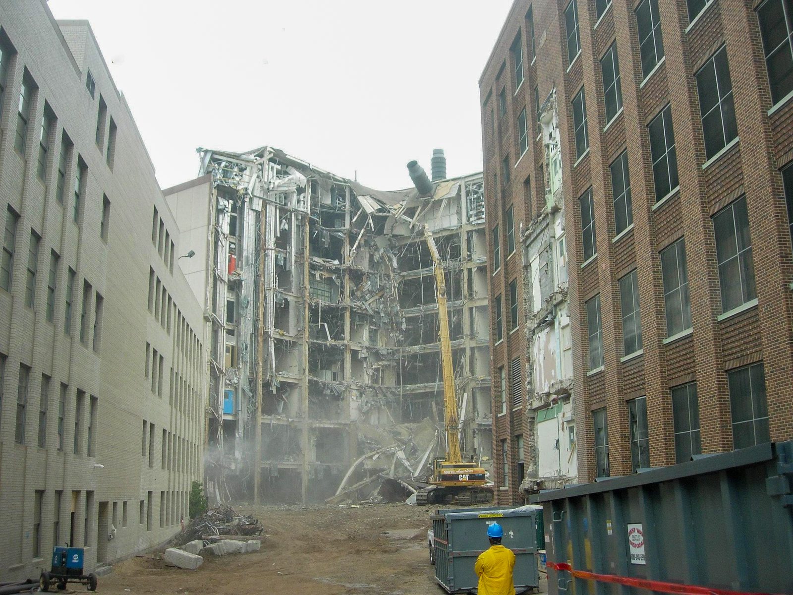Selective demolition of the upper floors of a pharmaceutical facility building