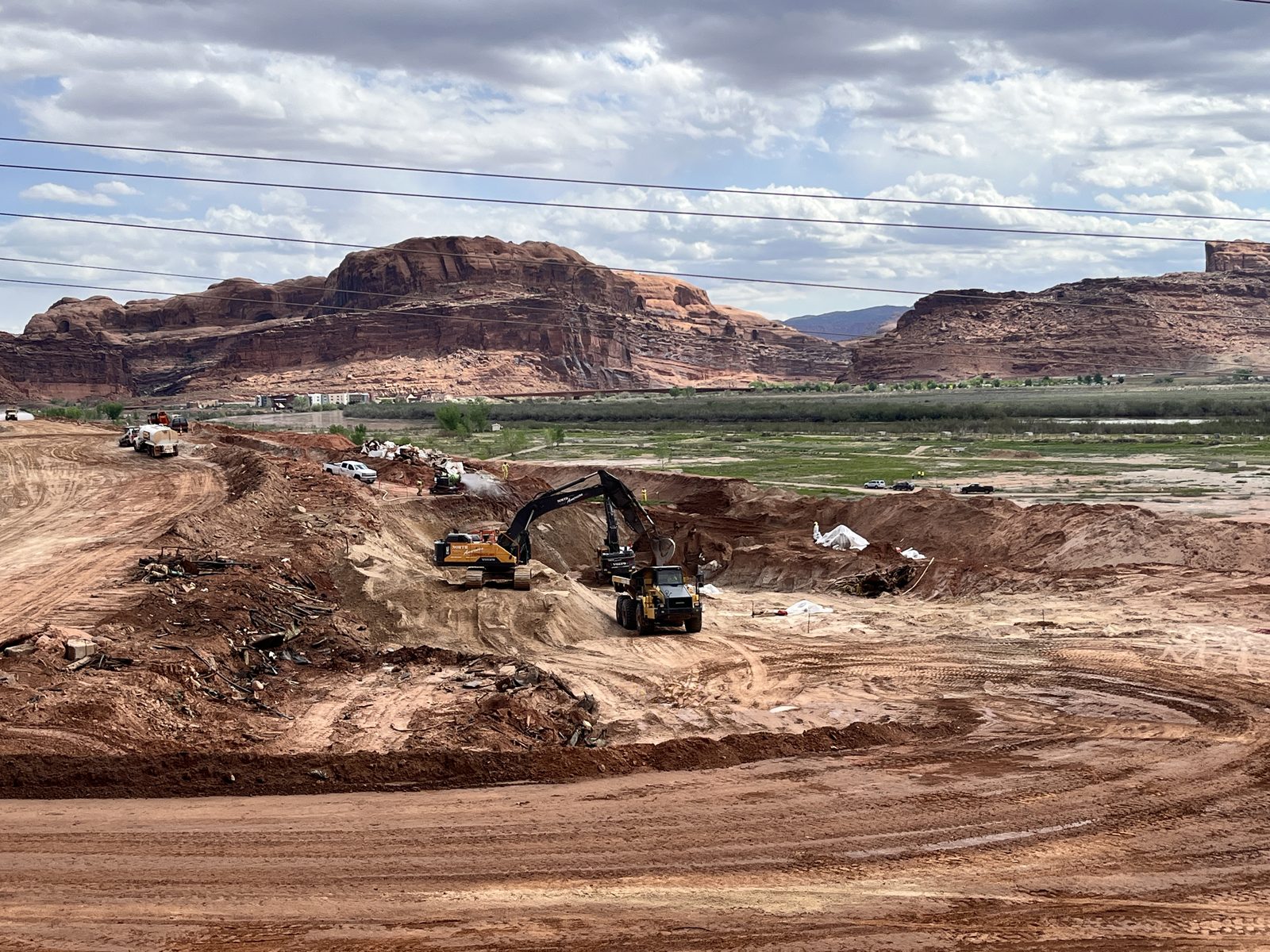 Excavator working at the Moab uranium mill tailings site in the Utah desert