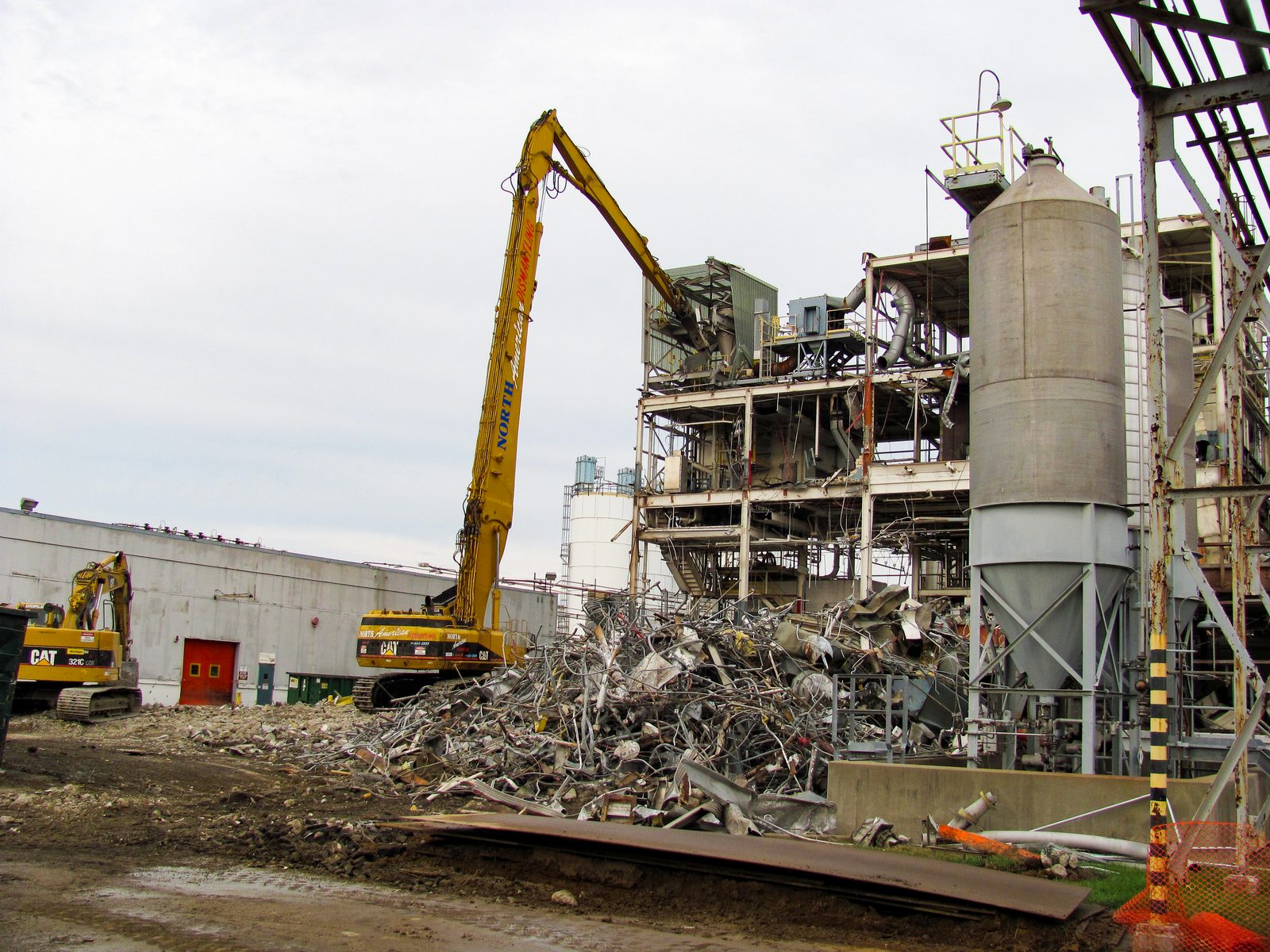 High-reach excavator pulling down a process structure at the SABIC facility