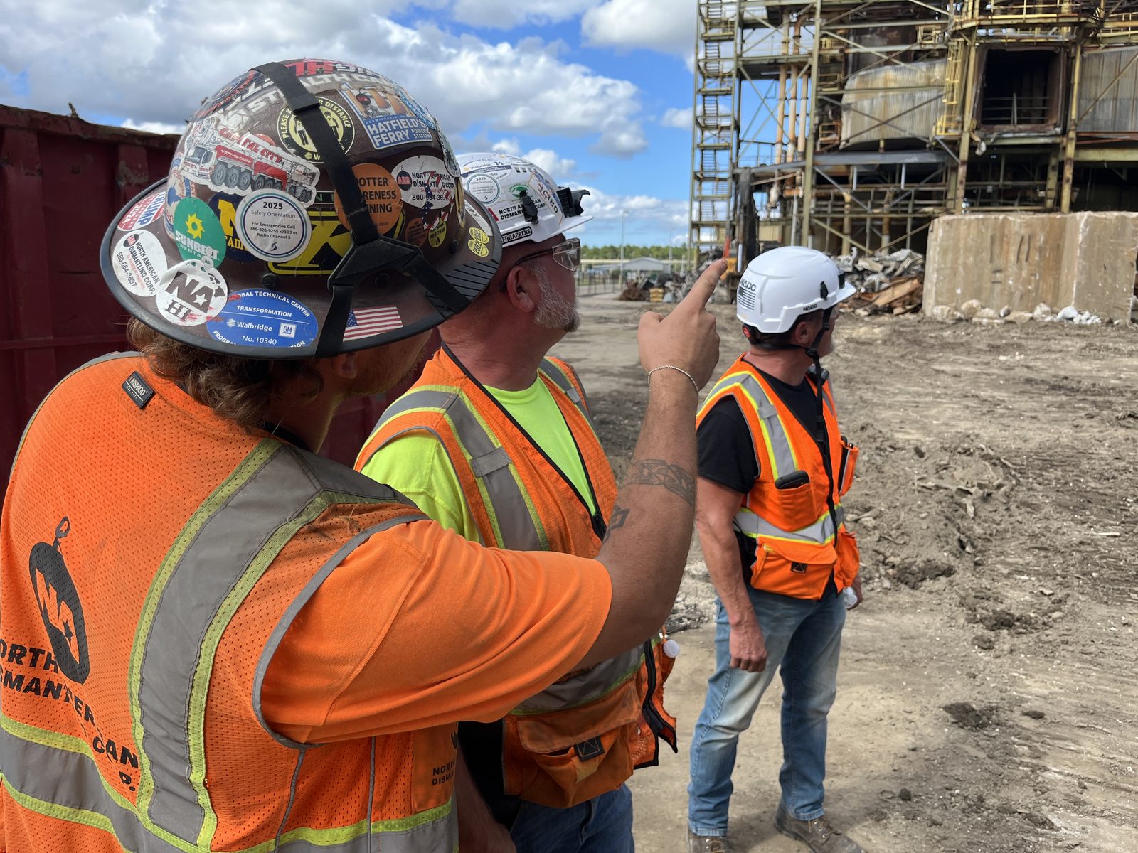 NADC crew reviewing safety planning before demolition work