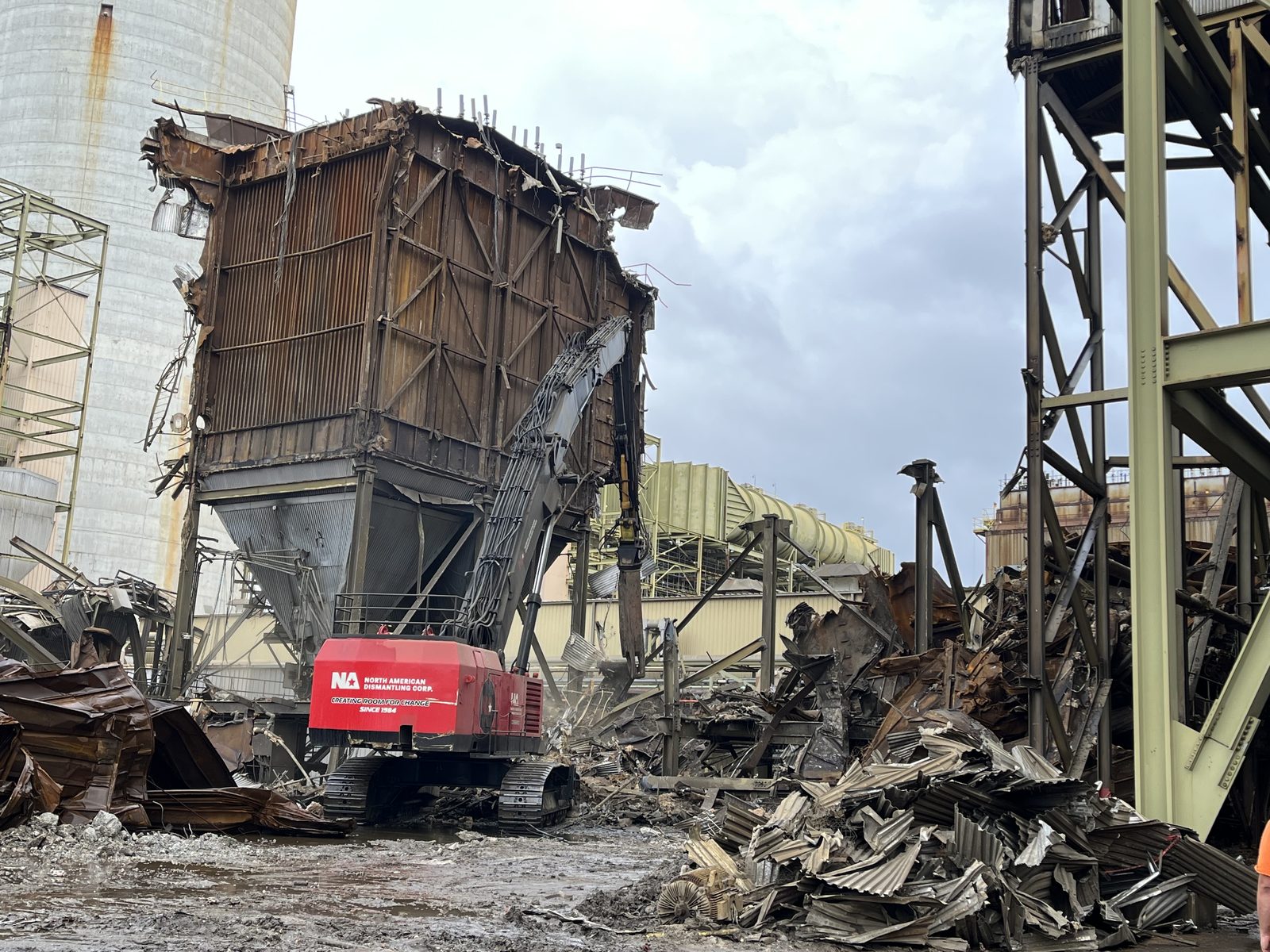NADC excavators performing coordinated demolition work on an industrial site
